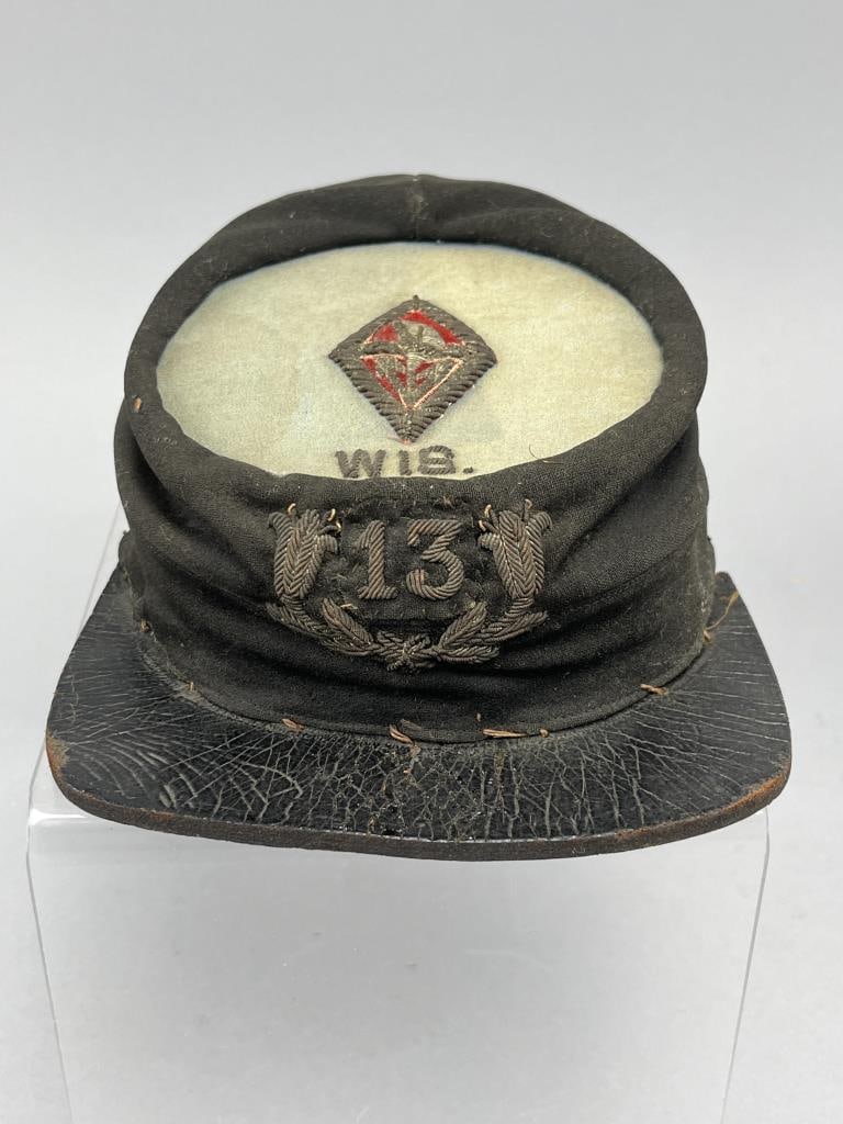 Post Civil War Volunteer Infantry Kepi Cap: Circa 1870's 13th Wisconsin Volunteer Infantry Regiment Chasseur Pattern Kepi cap. Cap is wool with leather bill, fabric lining is very worn, but says: Pettibone MFG. Co. Society Military &Band Goods.
