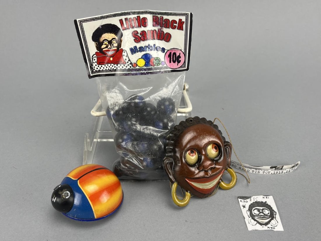 Google Eyed Tin String Pull Pin, Lehmann Bug Toy: German tin Black Face Collectible google-eyed string pull toy pin 2 3/4 x 2 1/2, Lehmann Lili 901 friction bug toy 2", Black Americana Little Black Sambo Marbles, bag 6" x 3 1/4". 3 items total.