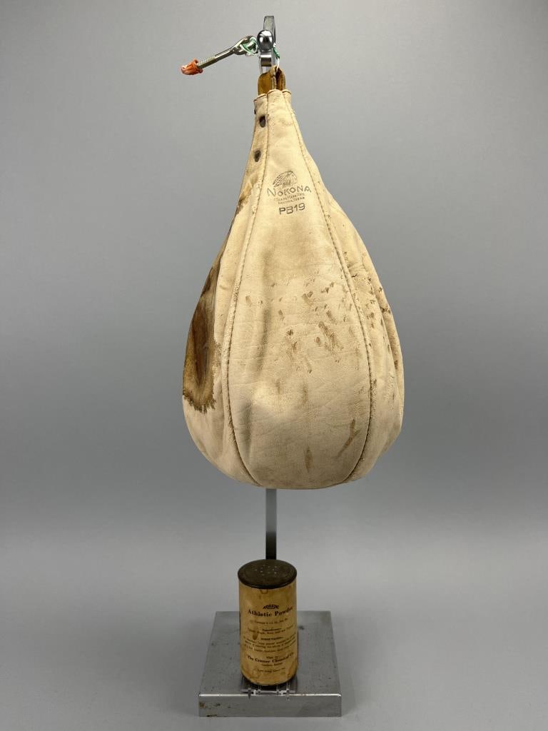 Vintage Boxing Bag/ Athletic Powder: Vintage leather boxing bag - measuring 15" tall with some age related issues - vintage athletic powder from 1941 - still has powder in it - measuring 4.5" tall