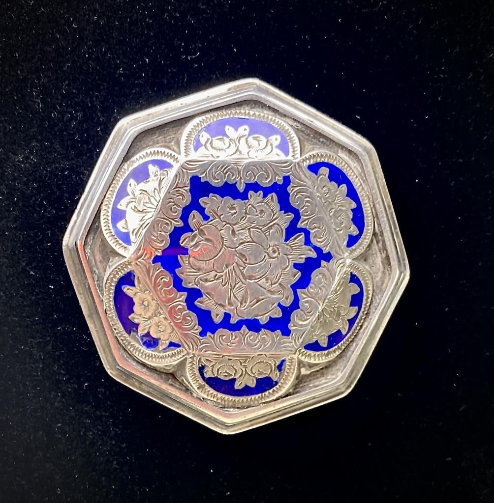 Hallmarked Sterling Enamel Brooch Adie Bros Ltd: From Adie Brothers Limited of Birmingham England a blue enameled chased Sterling Silver octagonal brooch circa early 20th century. Marked on back as shown. 1-7/8" x 1-7/8". Total weight 23 grams.