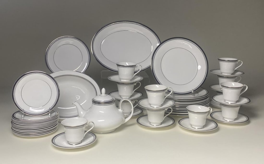 Royal Doulton Sarabande China Service for 12: Fine bone china from Royal Doulton in the Sarabande pattern, white bordered in black and silver bands with circles. Introduced in 1972, it was produced until 1998. Includes (1) teapot, (1) 13-1/4" pla