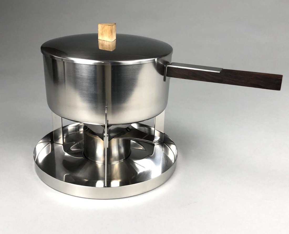 Arne Jacobsen for Stelton Fondue Pot 1967: Fondue Pot, designed by Arne Jacobsen (Danish 1902-1971), as part of the Cylinda Line for the Danish Company Stelton, and introduced in 1967, stainless steel and wood, 8-1/2" H.