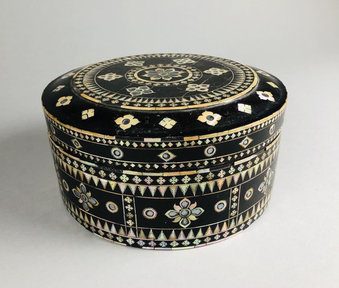 Lacquered Dowery Box Mother of Pearl Inlay 19th C.: Antique lacquered dowery box with mother of pearl or abalone and mirror inlay decoration, circa 19th Century, 9" D x 4-1/2" H.