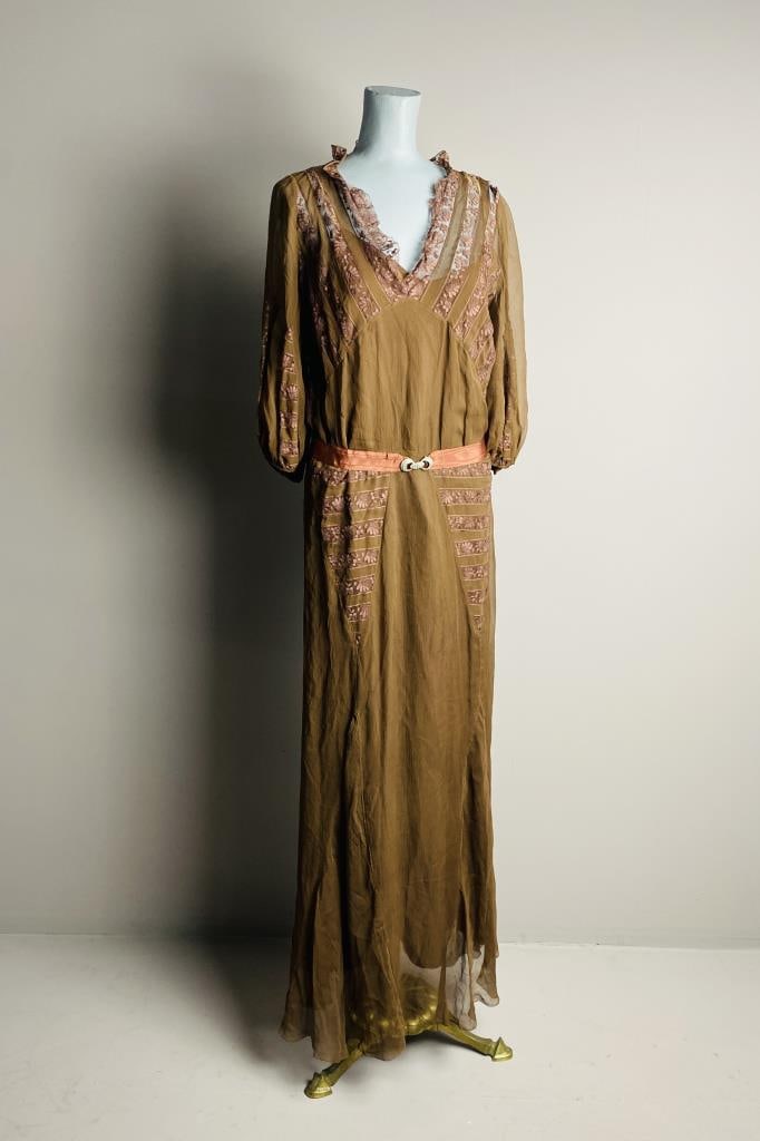 1920s Sheer Brown Silk and Lace Evening Gown: Full length evening dress in brown crinkled chiffon with lace insets circa 1920s-30s. Consists of a sheer overdress with a matching under slip. Under slip measurements - chest 36", waist 34", length 5