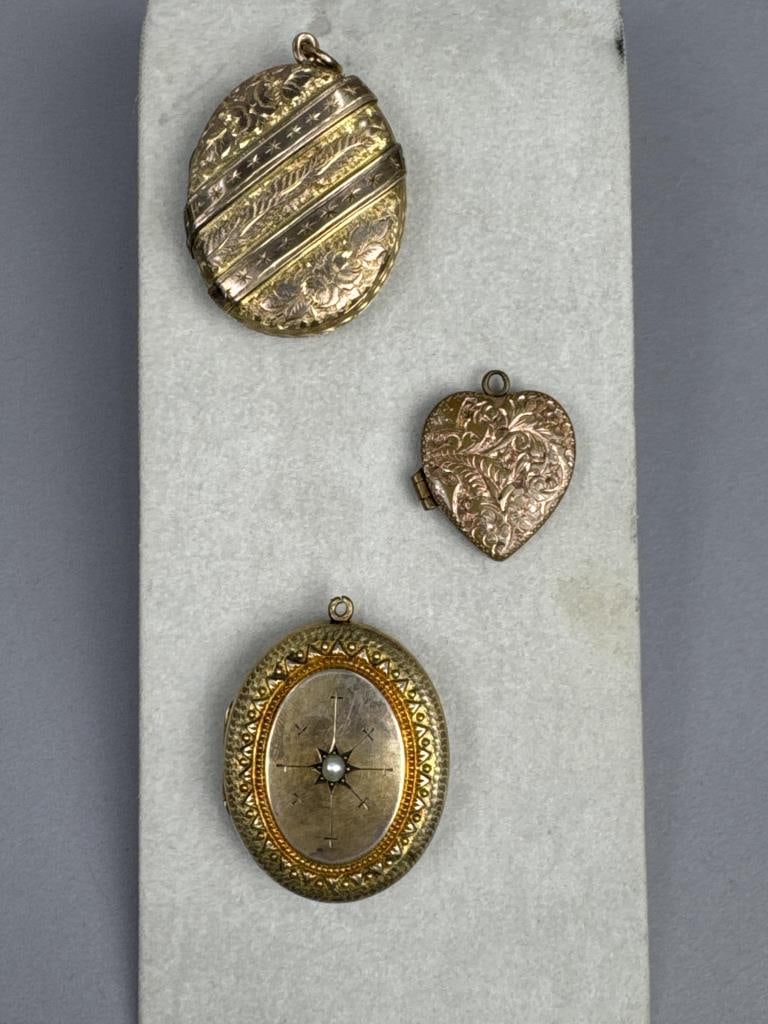3 Antique Gold Tone Ornate Etched Lockets: 1'' heart shape locket, 2 appx. 1 3/4'' oval lockets.Pinchbeck, faux pearl SHIPPING:In-House Shi