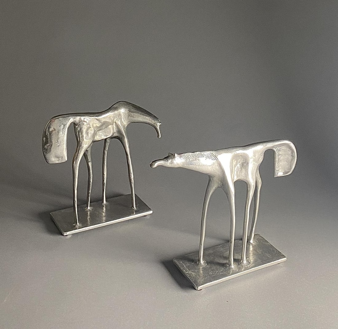 2 Don Drumm Cast Aluminum Horse Sculptures: Donald Drumm (American b.1935) two modernist cast aluminum horse sculptures circa mid to late 20th century. Signed on underside. 11" x 11" x 4" and 10-3/4" x 14" x 4".