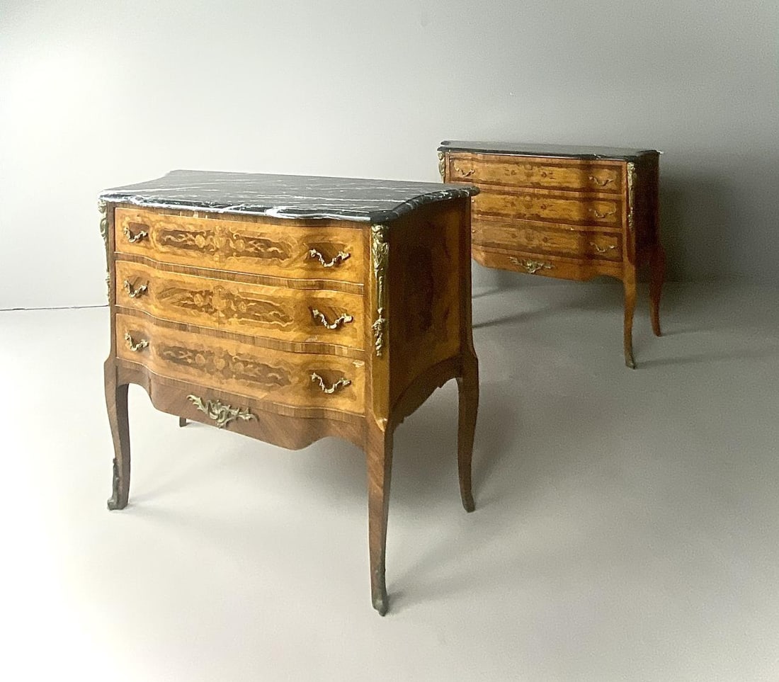 Pair of French Louis XVI Style Commodes: Pair of French Louis XV style, three drawer commodes or chest of drawers, with marquetry inlay, marble tops, and ormolu pulls and mounts, 17-3/4" L x 42" W x 34" H.