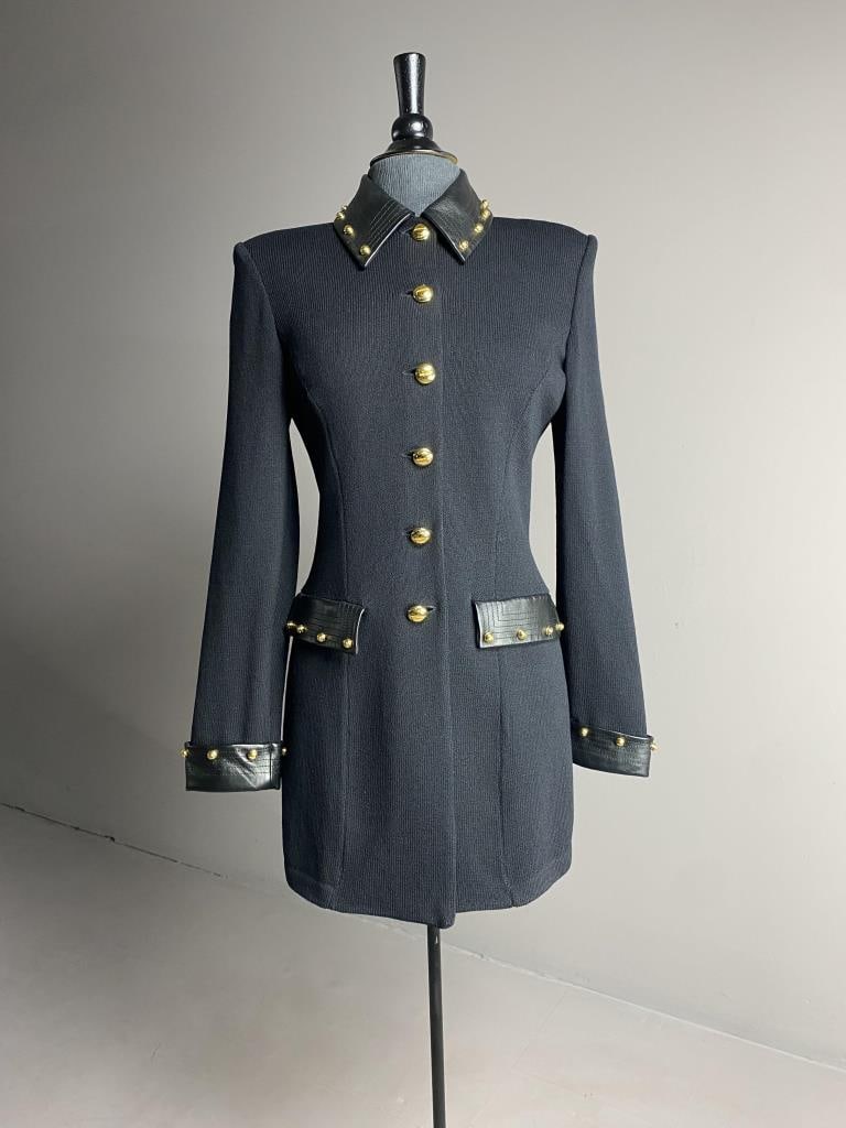 St. John Collection Knit Sweater w Leather Trim: 32" long St. John knitwear black sweater coat with leather collar, cuffs pocket covers, size 8, with gold "screw and bolt" buttons.