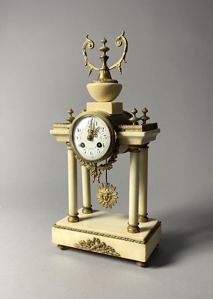 Antique A D Mougin French Alabaster Column Clock: Antique French column mantle clock, white alabaster and gilt bronze ormolu, circa 1870. The movement is stamped "A.D. Mougin", along with a star, "Duex Medailles", and serial number 3462. Includes two
