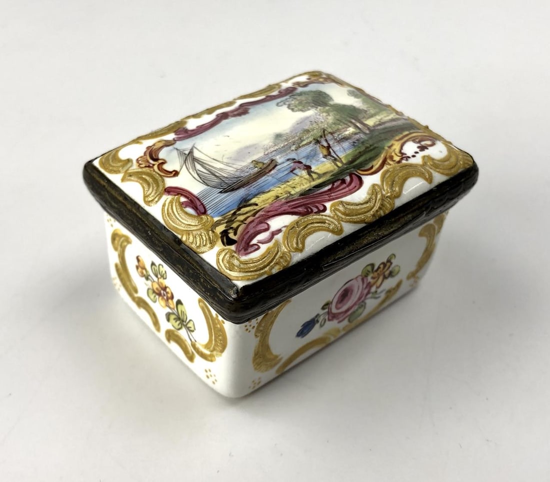 South Staffordshire Enamel Snuff Box c. 1770: South Staffordshire enameled snuff box, with hinged lid featuring a hand painted seashore scene with a sailboat and possible fishermen, and straight sides with flowers, all four sides and the top are 