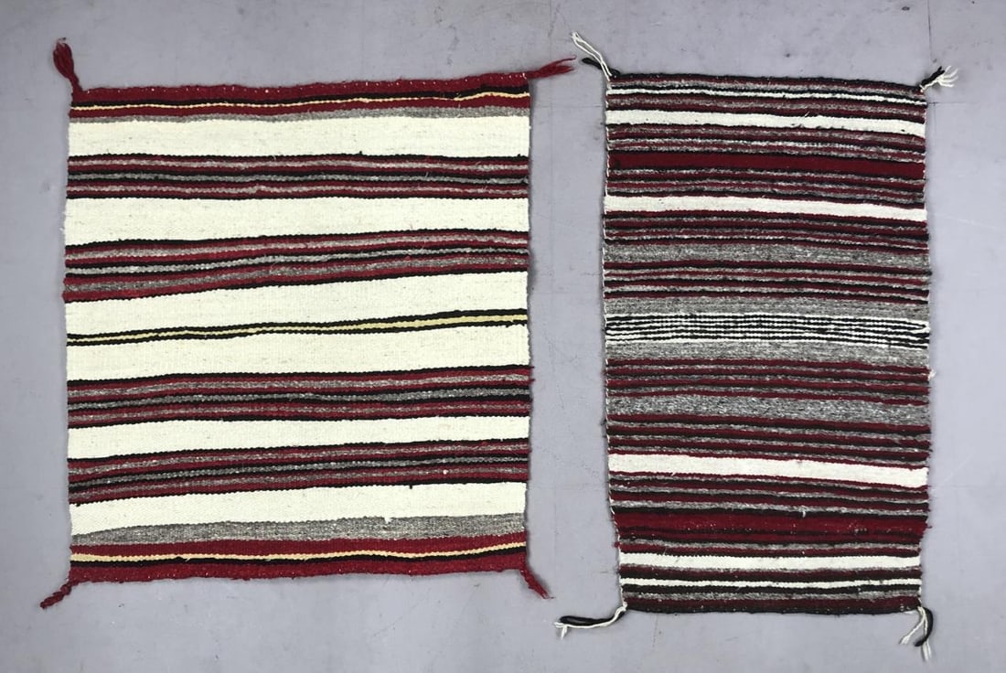 2 Navajo Hand Woven Banded Wool Saddle Blankets: Two Native American, Navajo, hand woven banded wool saddle blankets, 20th Century, the one on the left is approximately 31" L x 28-3/4"W and the one on the right is approximately 33-1/2" L x 19-1/2" W
