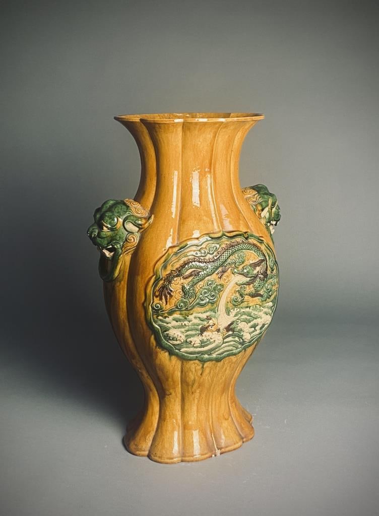 Monumental Chinese Sancai Temple Dragon Vase: Large Chinese pottery temple vase in the Sancai tri color glaze. Medallions depicting dragons front and back with foo dog handles at each side. Height 25".