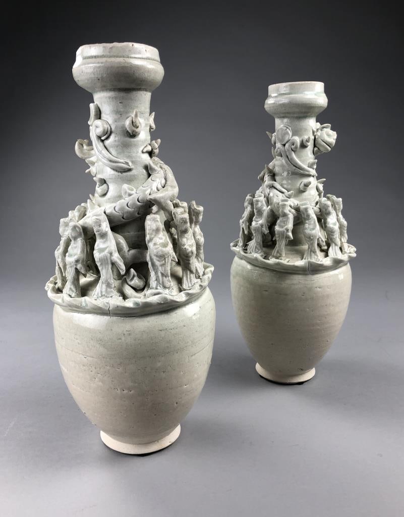 Pair of Chinese Yuan Dynasty Style Urns: Pair of Chinese Yuan Dynasty style, urns or vases, celadon glazed ceramic with high relief decoration in the form of 12 attendants and a dragon on each piece, 14" H. Purchased in 1998 in Bangkok, with