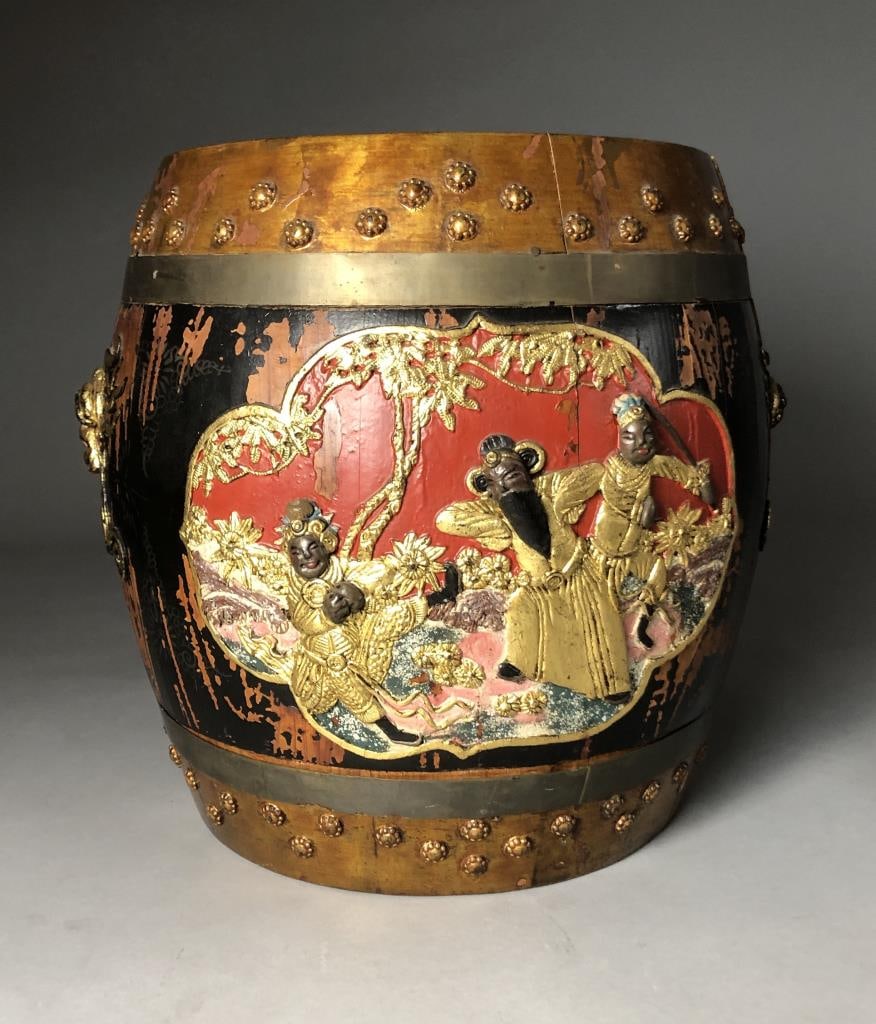 Antique Chinese Painted & Gilt Wood Rice Barrel: Antique Chinese lidded wood rice barrel, with ebonized, polychrome, and gilt decoration of opposed friezes in relief depicting human figures in a field, alternating with opposed lion masks also in rel