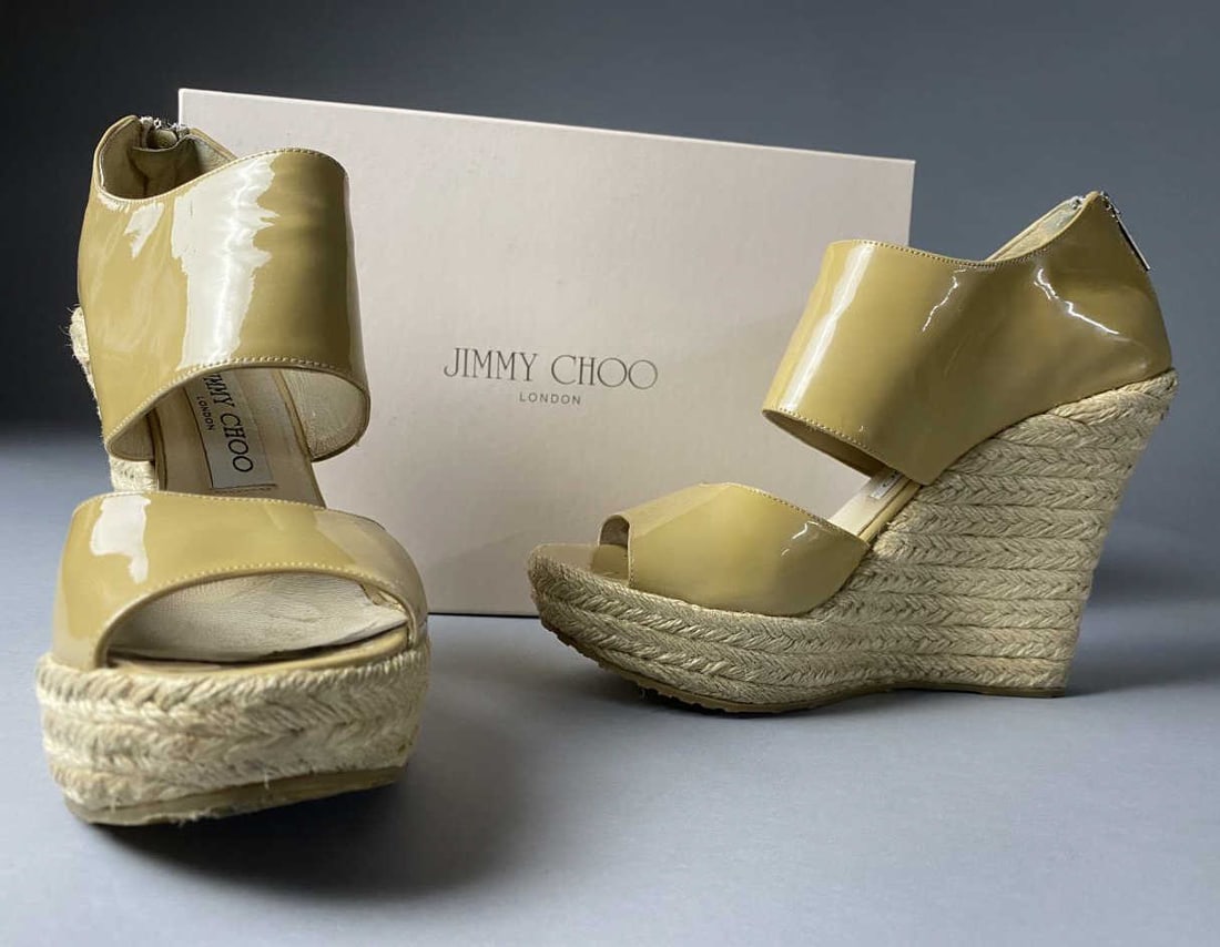 Jimmy Choo Addison Wedge Espadrilles, Nude Patent: Jimmy Choo London 247 Addison wedge espadrilles, size 37-1/2, size 6 U.S. nude patent leather 4-1/2" heel with 1-1/2" platform. Some marking on insole, otherwise good pre-worn condition.