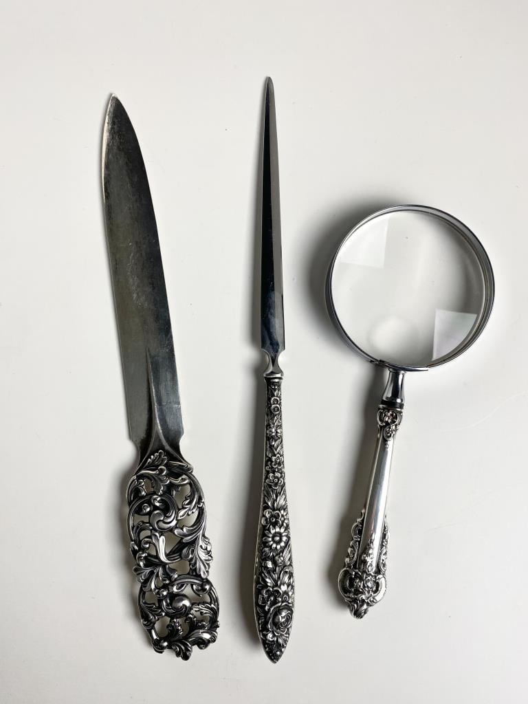 Two Silver Letter Openers & Magnifying Glass: R. Elvesaeter solid 830 silver letter opener, 9" and 89 gram, Kirk Stieff Repousse pattern sterling silver handle with stainless blade, 9-1/4" letter opener or paper knife weighs 89 grams total, and W