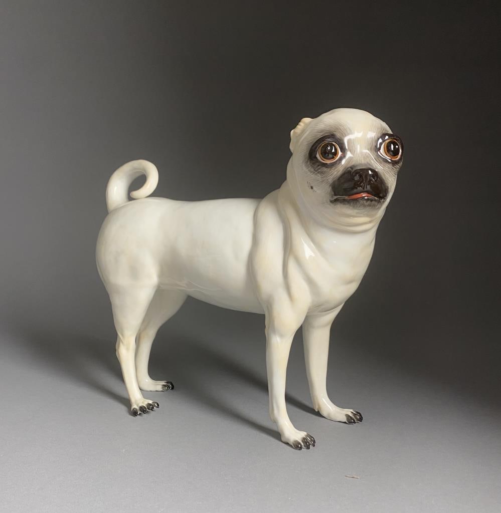 Meissen Porcelain Figure of a Standing Pug Dog 8": Meissen porcelain figure of a standing pug dog, marked on underside with the underglaze blue crossed swords mark, impressed "78690", "45W", and in underglaze red "2811", 8" H.