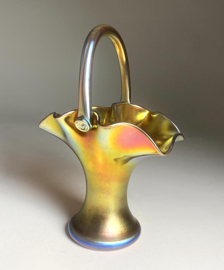 Steuben Glass Works "Aurene" Bride's Basket: Steuben Gold Aurene art glass bride's basket. Marked " Steuben Aurene 455". Height 9-1/2". Provenance: A private collector through The Frank H. Boos Gallery.