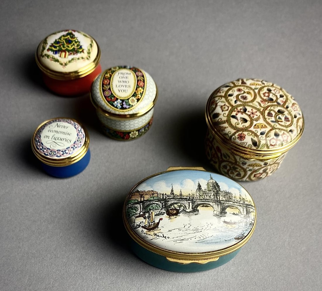 5 Halcyon Enamel Boxes London 17 C Textile: Five Halcyon Days enameled trinket or snuff boxes, one featuring the Waterloo Bridge and St. Paul's Cathedral in London, one with its original velvet lined box and paperwork, the largest box is approx