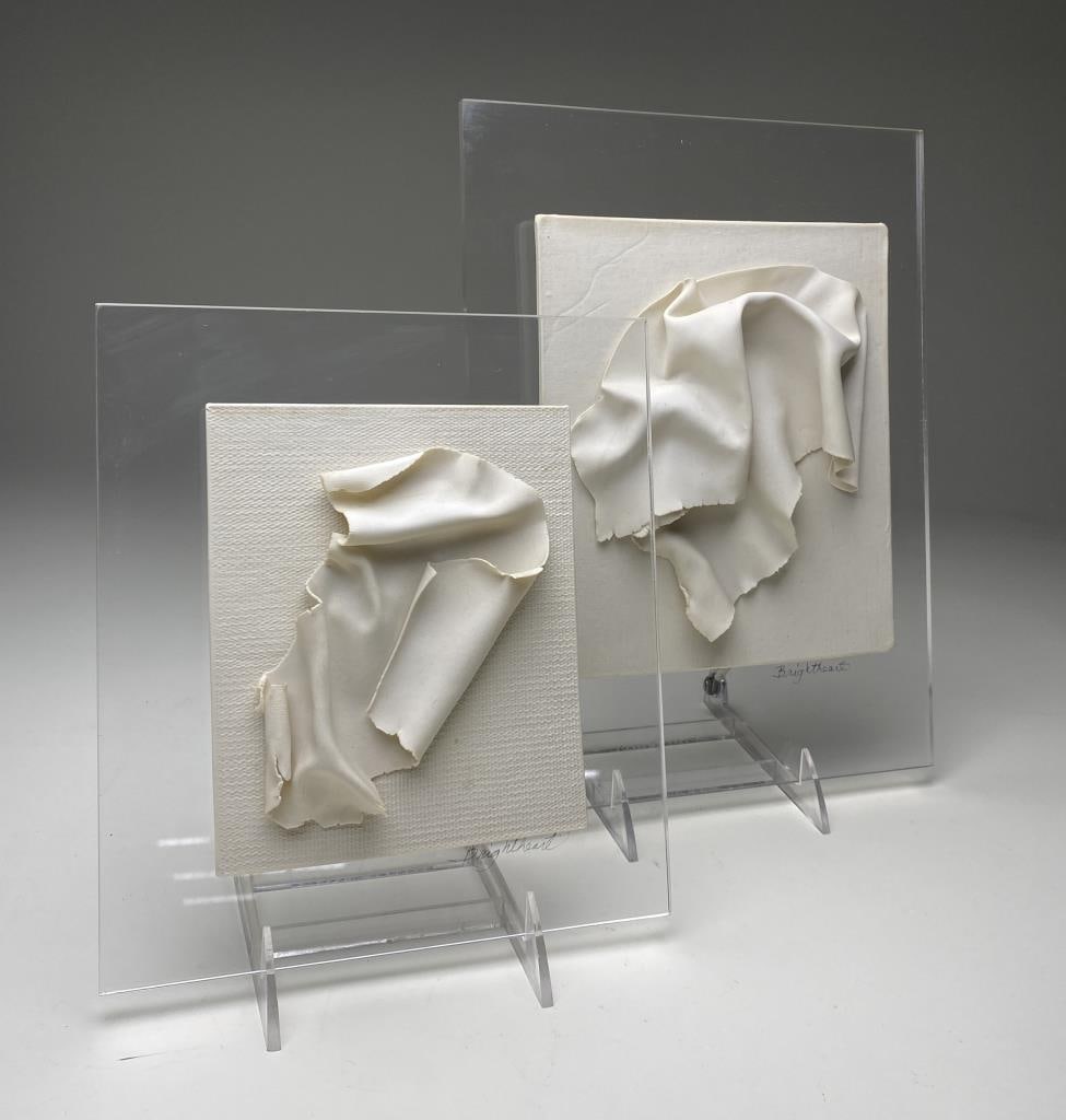 Brightheart Modernist Pottery Wall Sculptures: Delicate pottery wall sculptures circa 1970s signed "Brightheart". They are mounted on plexiglass. The larger piece measures 9" x 12", the smaller 8" x 9" (including plexiglass).