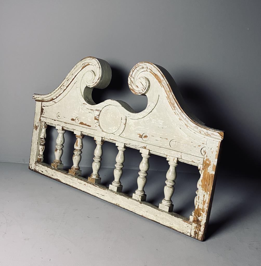 Antique Architectural Wooden Pediment: Antique architectural wooden fragment, a classical broken pediment over a turned balustrade. Old paint on what appears to be pine. Height 27-1/4", width 45-1/2", depth 3-1/2".