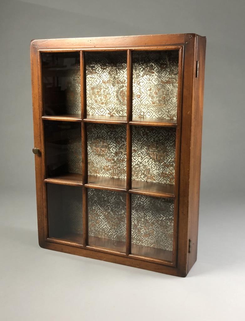 Edwin Cole Mahogany Wall Hanging Curio Cabinet: Mahogany wall hanging curio cabinet, attributed to the Samuel L. Dinkelspiel Company of Chicago, and designer by Edwin Cole (1905 - 1992),4-1/2" L x 18-3/4" W x 24-3/4" H.