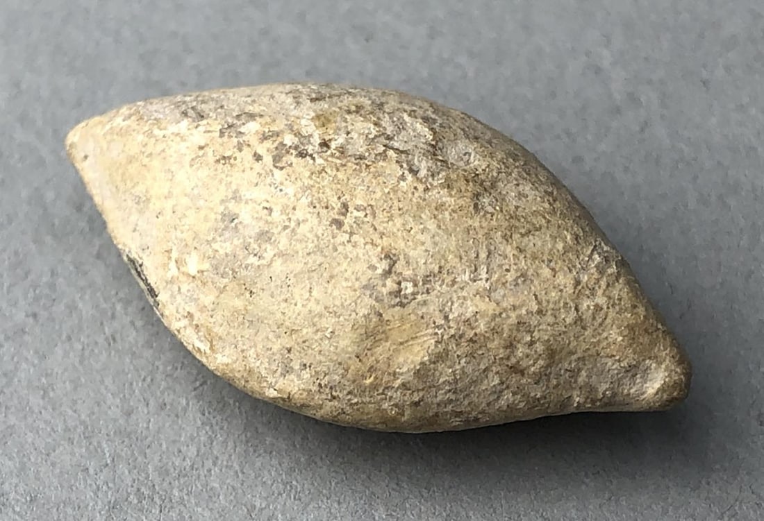 Ancient Roman Lead Sling Bullet: Lead sling bullet, most probably Ancient Roman and from the Imperial Period, circa 1st - 3rd Century CE, 1-1/4" in length. Provenance: ex-private East Lansing, Michigan, USA collection of ancient anti