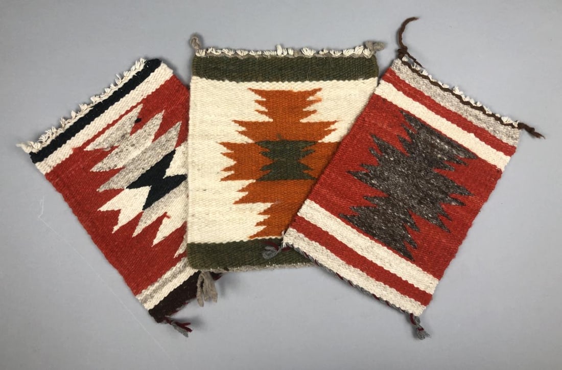 3 Miniature Navajo Sampler Rugs or Gallup Throws: Three Native American, Navajo, hand woven wool sampler rugs, Gallup throws, tabletop mats, or wall hangings, 20th Century, the largest one is approximately 10" L x 9" W.