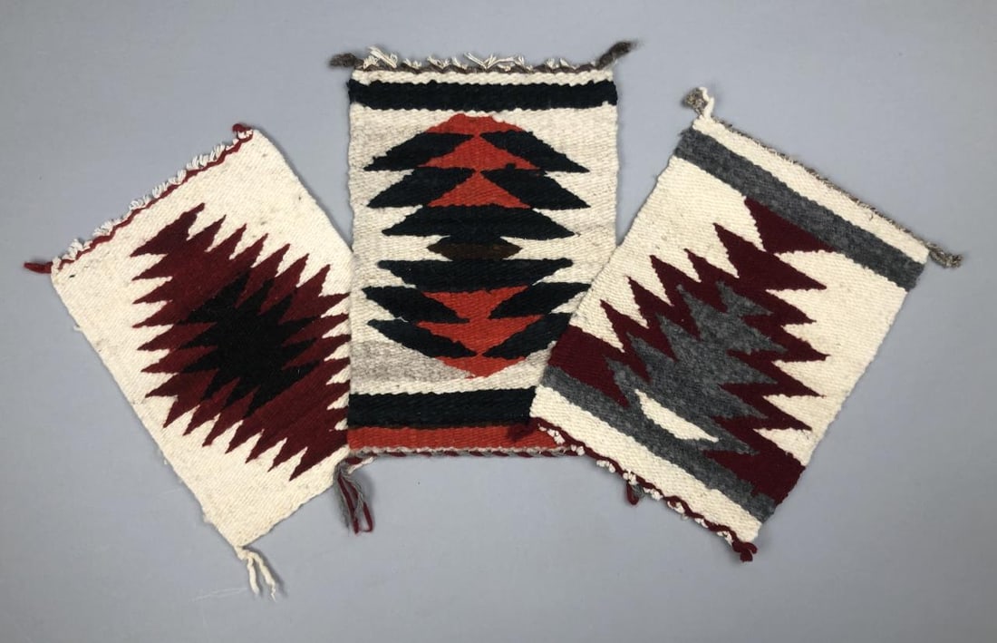 3 Miniature Navajo Sampler Rugs or Gallup Throws: Three Native American, Navajo, hand woven wool sampler rugs, Gallup throws, tabletop mats, or wall hangings, 20th Century, the largest one is approximately 10-1/2" L x 7" W.