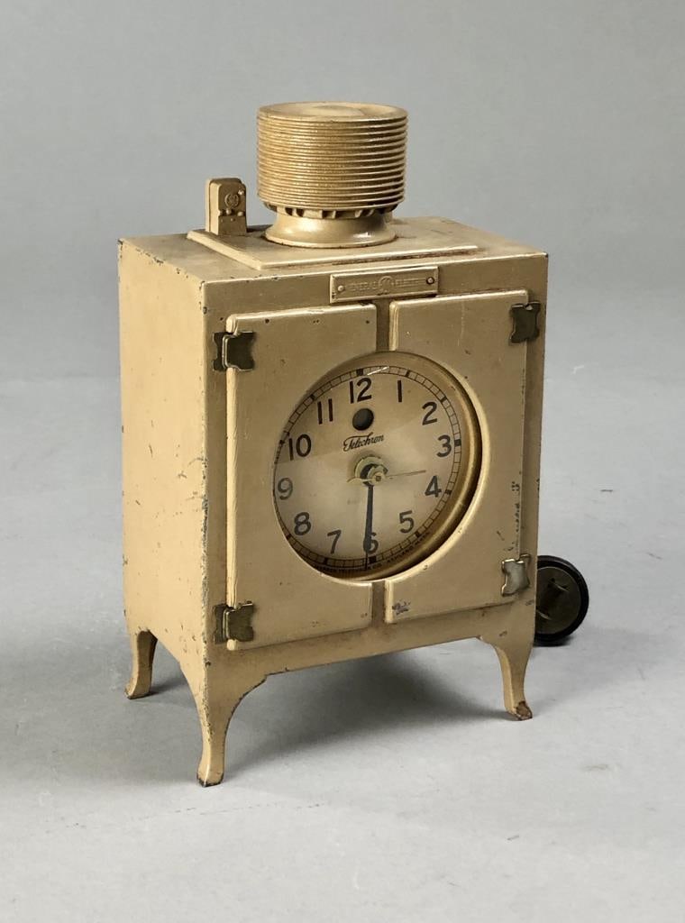 General Electric Monitor Top Refrigerator Clock: GE promotional advertising clock, given away to buyers of General Electric's "Monitor Top" electric refrigerators, painted due-cast metal with Warren Telechron Company clock insert, circa late 1920's