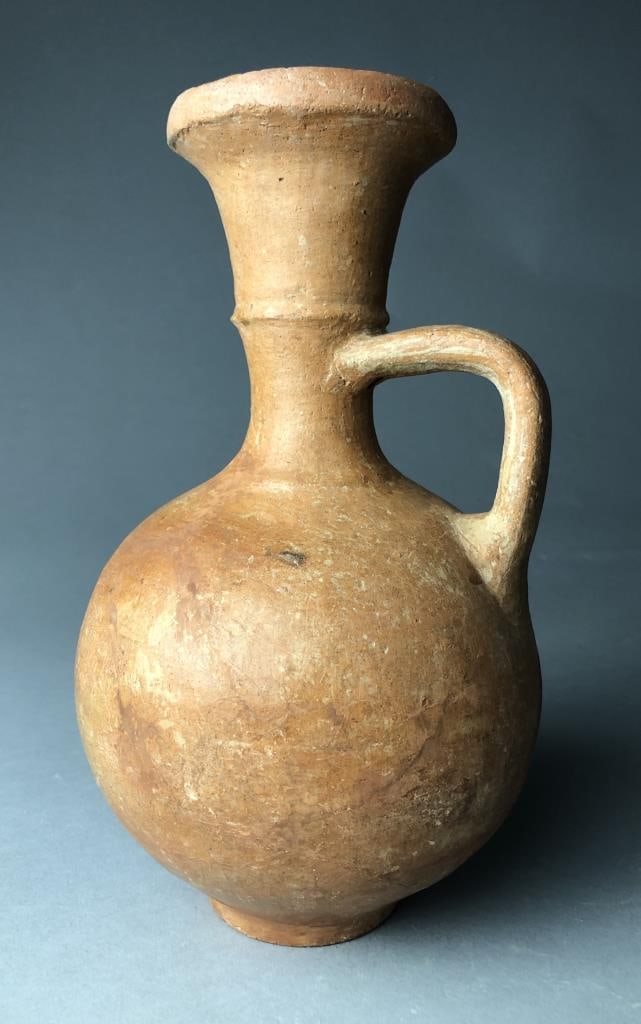 Ancient Holy Land Polished Red Ware Wine Jug: Ancient Holy Land, possibly Phoenician, polished red ware wine jug or wine jar, circa 1000 BCE, approximately 9-1/2" in height.Provenance: ex-private East Lansing, Michigan, USA collection; Annie Trot