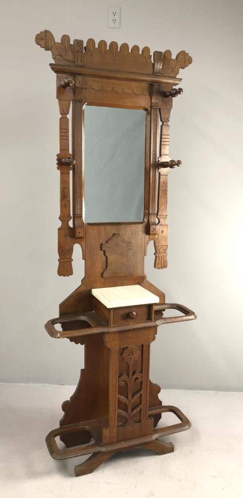Aesthetic Movement Hall Tree Late 19th C.: Victorian Era, Aesthetic Movement, hall tree, American Black Walnut wood, circa 1880s/1890s, 11-1/2" L x 32" W x 82" H.