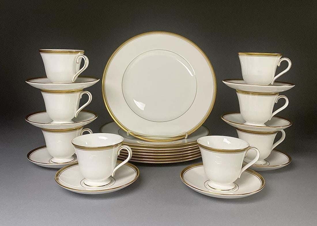 Harcourt Gold by Waterford China 24 Pieces: Waterford China dinner wear or dinner service, in the Harcourt pattern with gold accents, made in England, includes: (8) 10-3/4" dinner plates; and (8) cup and saucer sets. Marked on bottom.