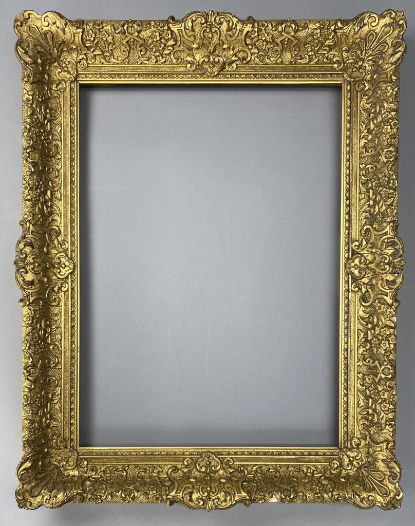Gilded Gesso Over Wide Wood Frame 29-1/4" x 23": Very ornate and detailed ornamentation in a floral motif, purchased at Sotheby's, overall size 29-1/4" x 23", sight size 22-1/4" x 16", rabbet size 22-7/8" x 16-3/4".