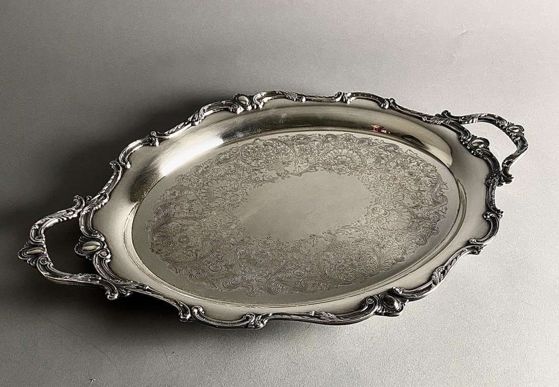 International Silver Rochelle Serving Tray 24-3/4": Large serving tray by International Silver in the "Rochelle" pattern, with double handles and applied Rococo style border, 24-3/4" L, includes a protective zippered anti-tarnish silver storage bag.