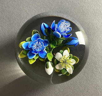 Ken Rosenfeld Flame Work Paperweight Flowers: Ken Rosenfeld (American, 1950 - ), studio art glass paperweight, with flame work blue and white flowers, buds, and foliage, dated '87. Signature "R", engraved signature and date on lower side. Approxi