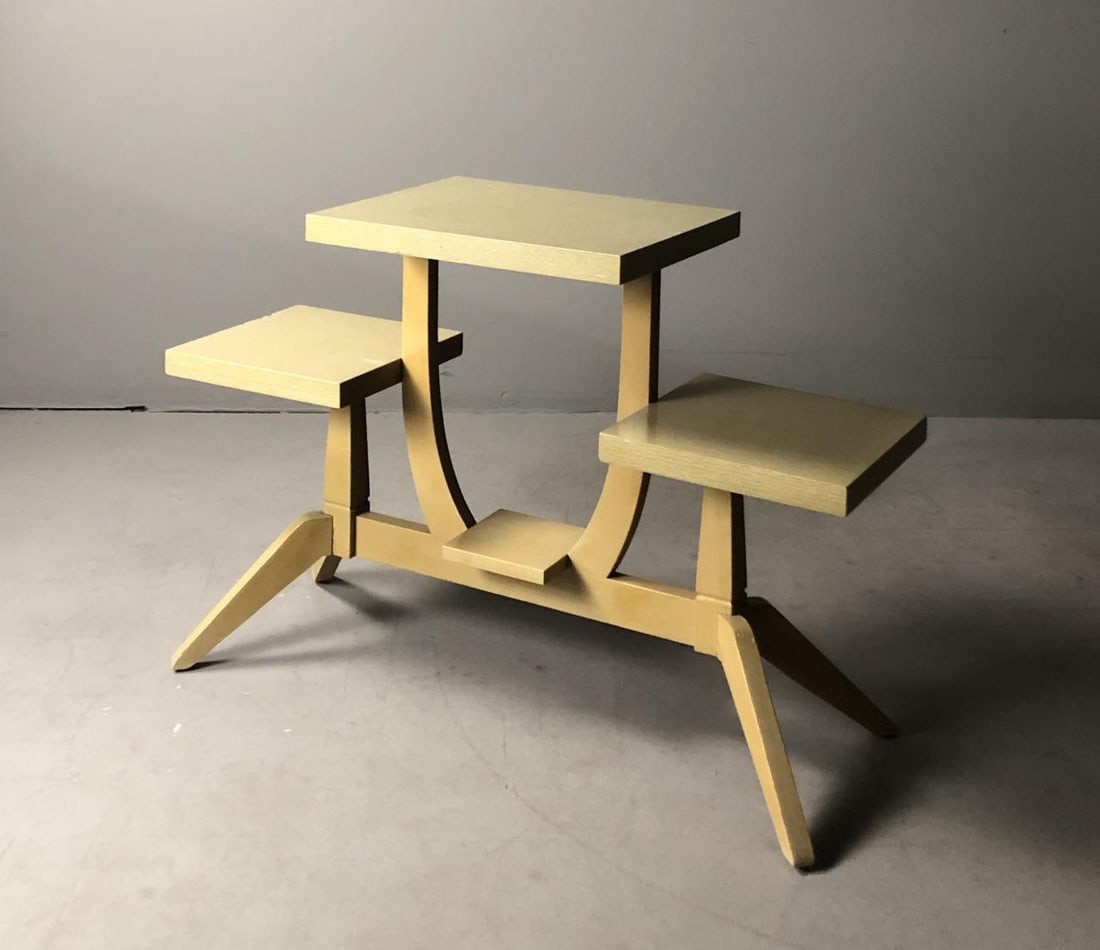 1950s Limed Wood & Laminate Tiered Table: Limed Wood and laminate tiered table, in the style of Heywood Wakefield, circa 1950s, approximately 38" x 14-3/4" x 26".