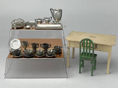 Arcade Toys Kitchen Table, Chair & Dishes: Cast iron 1920-46. Kitchen table, marked Freeport, Ill. On bottom, "Boone" on the table top. Table is $ 3/4 x 2 7/8 x 3 1/4" tall. Chair is 4" tall. 24 pc. Dishes. No lids, marked Germany.