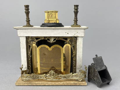 Ormolu Fireplace In 1/2" Scale W/ Accessories: Could it be Tinietoy? It is paper covered wood and beautifully appointed. Soft metal detail in great condition. Fender, metal coal scuttle, candlesticks and clock. Added is a new 1/2" fire