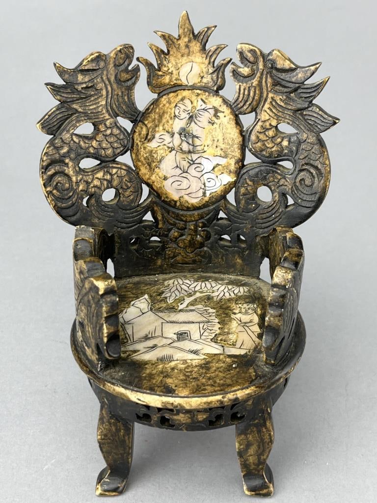 Hand Carved Indonesian Chair, 5 1/4": Could be bone. Inlaid Mother of Pearl. No Markings. Quite a statement piece.