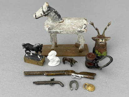 Horses, Guns And More: Handmade white horse, 3". 2 horse statues, a horse brass and horseshoe. Metal keg for a St. Bernard. Wooden taxidermy buck. Rifle, pistol and bull. 