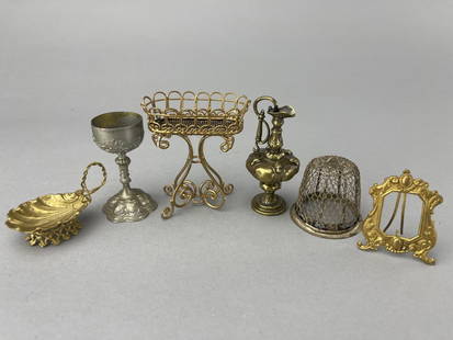 Soft Metal 19Th C. Accessories: Silver wire birdcage, no bottom, 2" dia., 2" tall. Oval wire planter, missing one foot, 3". Tall Pitcher vessel, 3". Standing frame, 2 x 1 1/2". Footed shell dish with handle, 2" x 3/4" tall.