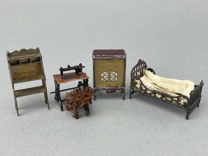 Group Of 1/2" Miniature Vintage Furniture: A Metal TootsieToy Radio. A gold metal slant front desk missing the slant. A 1900-30 metal bed with original bedding. Gold and black sewing machine. Tiny chair made from a nut. 5 pieces. 