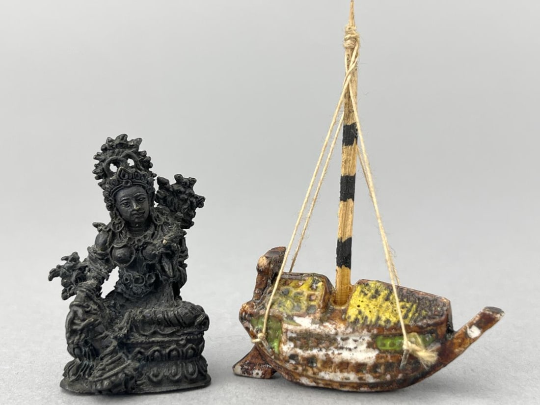 Tibet/Hindu Diety Statue And Asian Junk Boat: Diety is 1 1/2" tall, metal and has an unknown mark. Very well done. The Chinese junk is 1 1/2 x 2 1/4" tall, porcelain. Both fine art for your Asian inspired home.