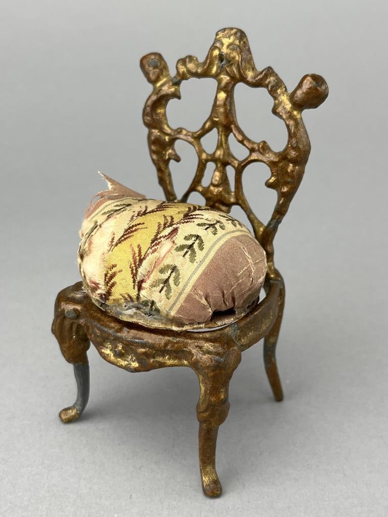 French Ormolu Chair, 1840-60: Original seat may have been porcelain,but if it was, this replacement is still 19th century. 2 1/4 x 2 x 4 1/4' tall.