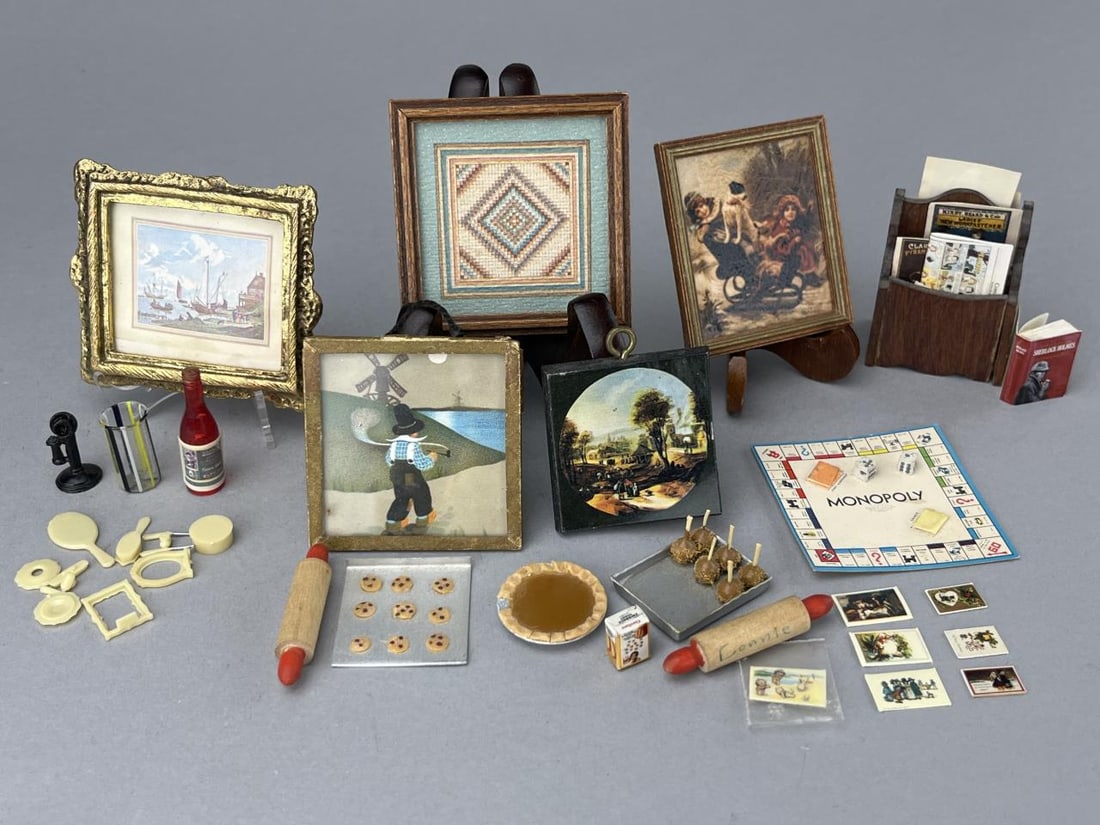 Assorted Miniature Accessories: Assorted ephemera, 5 prints, cookies and candy apples, a glass and wine, phone, 2 rolling pins, Chrysnbon dresser set, a pie and monopoly game. Sherlock Holmes book, a box of Cinnamon Toast! Also a Ca