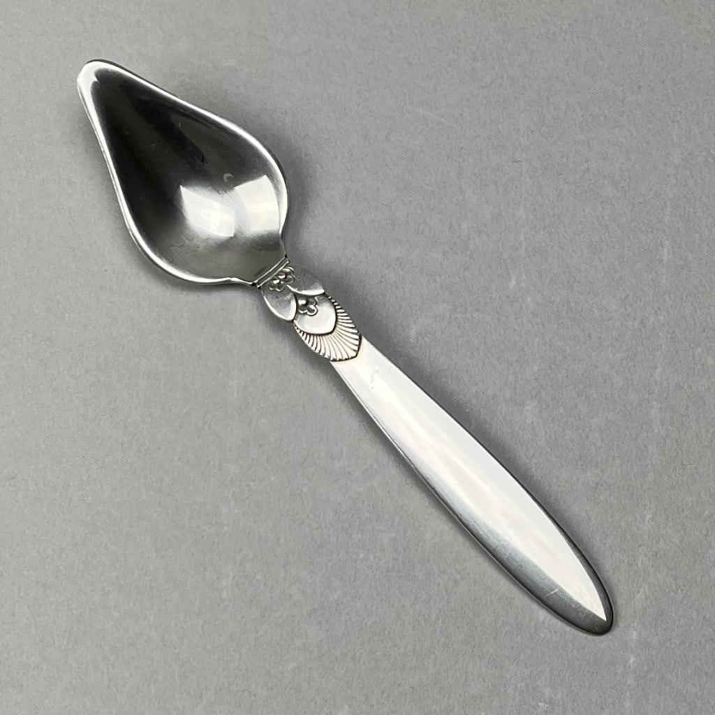 Georg Jensen Cactus Sterling Grapefruit Spoon: Georg Jensen sterling silver grapefruit spoon, in the "Cactus" pattern, designed by Gundorph Albertus (Danish, 1887 - 1969) and introduced in 1930, 5-7/8" L, 32 grams.