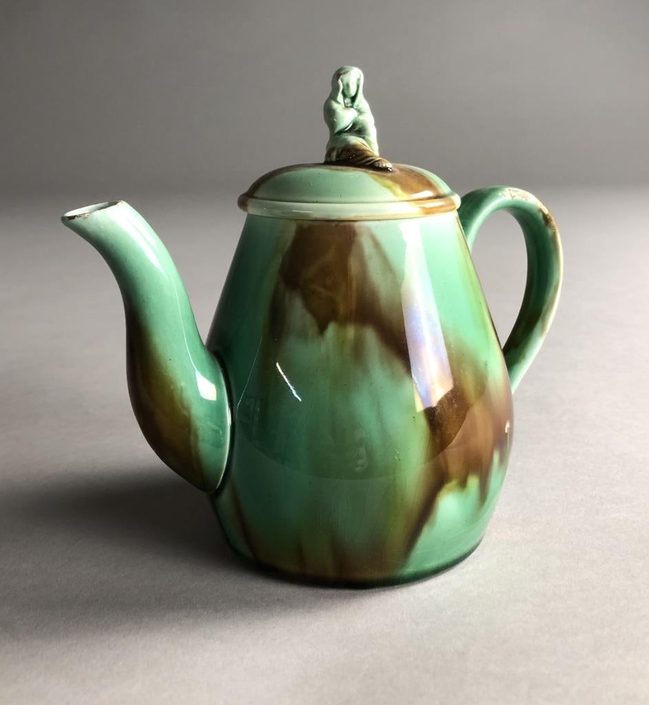 19th C. Scottish Belfield Teapot with Widow Finial: Unmarked, but most likely a Belfield Pottery (Scotland), copy of a Wedgewood teapot, with a mottled glaze and figural finial representing Sybil, the Widow of Zarephath, circa late 19th / early 20th Ce