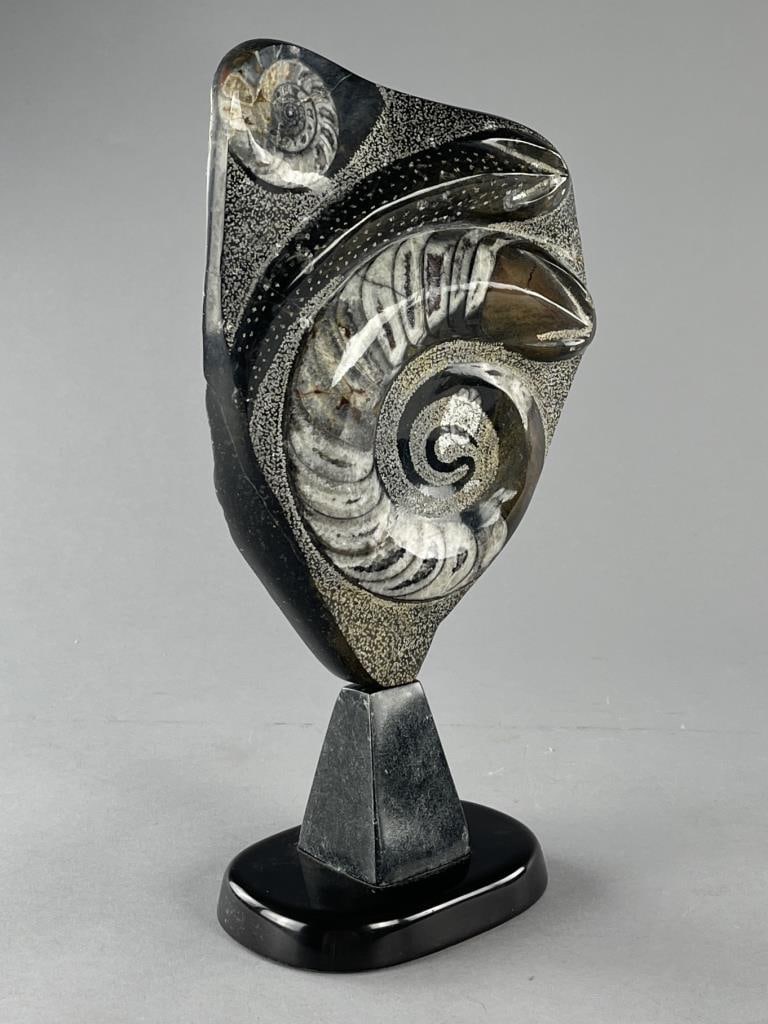 Polished Orthoceras & Ammonite Fossil Specimen: Polished Orthoceras and Ammonite fossil specimen, or statue, on stand, possible signature and date etched on reverse, approximately 14" (H) x 7" (W), including stand.
