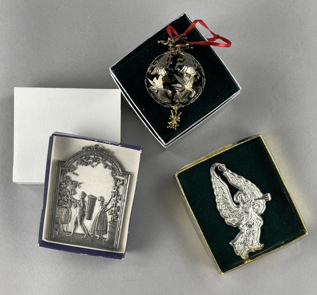 3 Christmas Ornaments Schweizer, Lunt & Kirk: Three vintage collectible Christmas ornaments, including Lunt silverplated sphere with angels with harps and trumpets, Kirk Stieff pewter angel with trumpet, and Wilhelm Schweizer Bavarian pewter "Fal